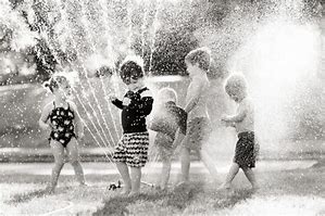 kids in sprinklers 1